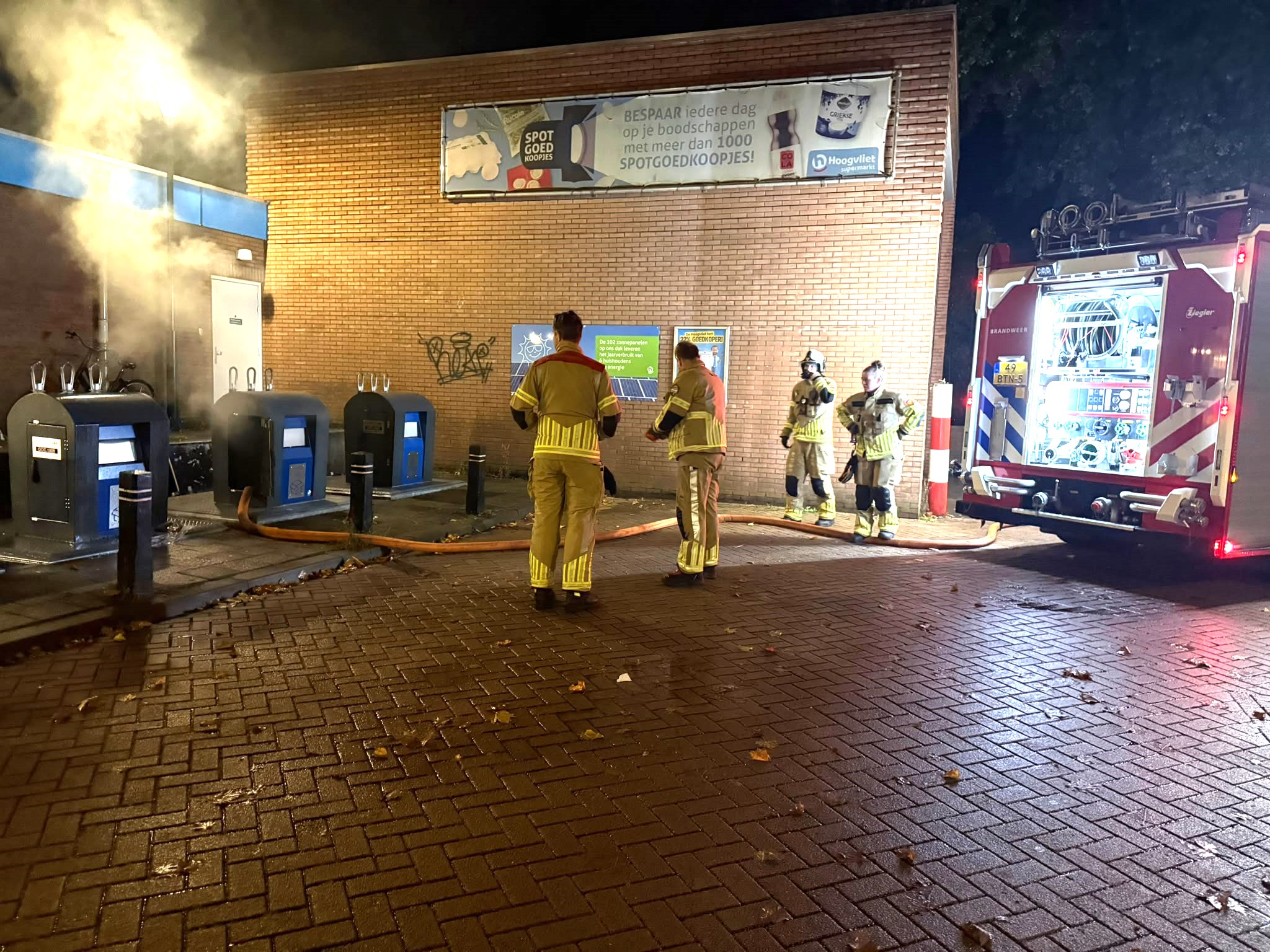 Inhoud papiercontainer in brand